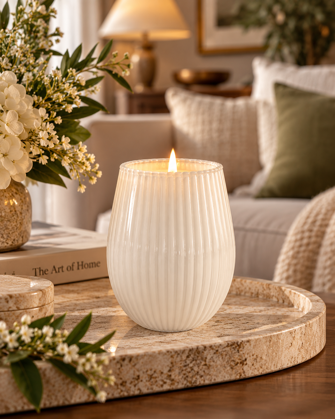 Ivory ribbed 400g soy candle styled in a warm living room